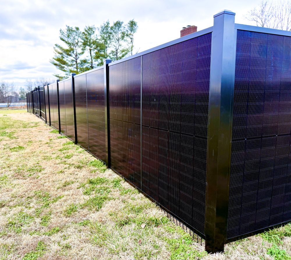 SolFence solar privacy fence with bifacial panels installed along a residential property line